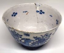 Large 18th century Dutch Delft punch bowl decorated with birds on rockwork amongst floral sprays (