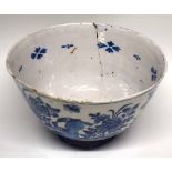 Large 18th century Dutch Delft punch bowl decorated with birds on rockwork amongst floral sprays (