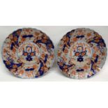 Two large Japanese porcelain chargers decorated in Imari style with shaped rims, 41cm diam (2)