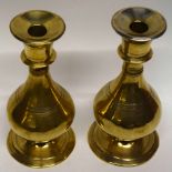 Two brass baluster shaped candlesticks