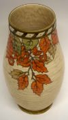 Crown Ducal ribbed vase decorated with a tube lined design of autumn leaves, by Charlotte Rhead,