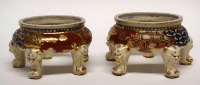 Two Satsuma stands both raised on three paw feet with Japanese characters to border (2)