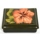 Moorcroft box and cover, the green ground with floral design of hibiscus, 12cm long