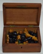 Wooden box containing quantity of wooden chess pieces