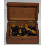 Wooden box containing quantity of wooden chess pieces