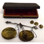 Box containing series of very small brass weights and weighing machine