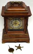 Large mantel clock in wooden case with Roman numerals and gilt spandrels