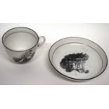 Early 19th century cup and saucer, black printed with and Adam Buck style print, the saucer 13cm