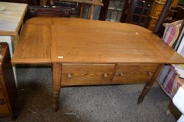 UNUSUAL STAINED PINE TABLE RAISED ON TURNED LEGS WITH TWO DEEP DRAWERS BENEATH, COMPLETE WITH