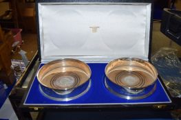 BOX CONTAINING TWO LONDON SILVER WINE COASTERS