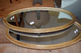 PAIR OF GILT FRAMED OVAL MIRRORS, EACH LENGTH APPROX 77CM