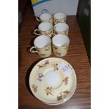 COFFEE SET BY AYNSLEY COMPRISING SIX COFFEE CANS AND SAUCERS IN THE GAIETY DESIGN