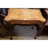 WALNUT FOLDING CARD TABLE, RAISED ON BALL AND CLAW FEET, WITH CROSS BANDED DECORATION, WIDTH