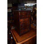 Small mahogany specimen type cabinet fitted with seven drawers on a plinth base^ 31cm wide