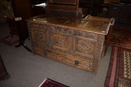 Oak blanket box^ the lifting lid with four plain panels over a void interior with candle box and