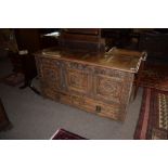 Oak blanket box^ the lifting lid with four plain panels over a void interior with candle box and