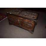 Early 20th century camphor wood Oriental coffer^ typically moulded decoration throughout and