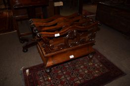 19th century mahogany Canterbury^ the top fitted with three sections over moulded frieze drawer on