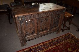 18th century and later oak coffer with plank top and three panelled carved front^ (substantially