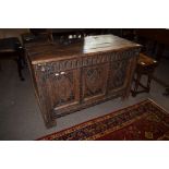 18th century and later oak coffer with plank top and three panelled carved front^ (substantially