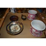 JAPANESE PORCELAIN BOWL AND A PAIR OF PLANTERS AND STANDS DECORATED IN RELIEF WITH FLOWERS ON A PINK