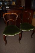 Pair of Victorian rosewood balloon back dining chairs with green upholstered seats and cabriole