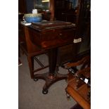 Early 19th century rosewood tepoy^ the sarcophagus moulded rectangular top enclosing fitted interior