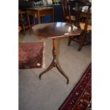 Rosewood simulated octagonal pedestal table with ring turned support and tripod base^ circa early