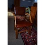 Oak carver chair red upholstered back and seat^ the four plain supports joined by an H stretcher