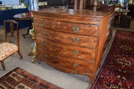 Early 19th century mahogany bow fronted chest^ cross banded top and inlaid frieze over two short and