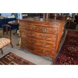 Early 19th century mahogany bow fronted chest^ cross banded top and inlaid frieze over two short and