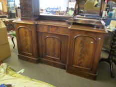 Victorian mahogany sideboard^ of break front form with three arched panelled doors and central