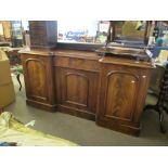 Victorian mahogany sideboard^ of break front form with three arched panelled doors and central