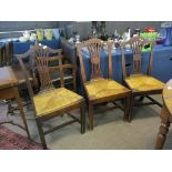 Set of three Chippendale style oak dining chairs^ all with rush seats