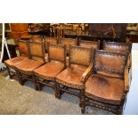 SET OF TEN OAK LEATHER BACKED AND SEATED MONASTIC STYLE DINING CHAIRS COMPRISES TWO CARVERS AND