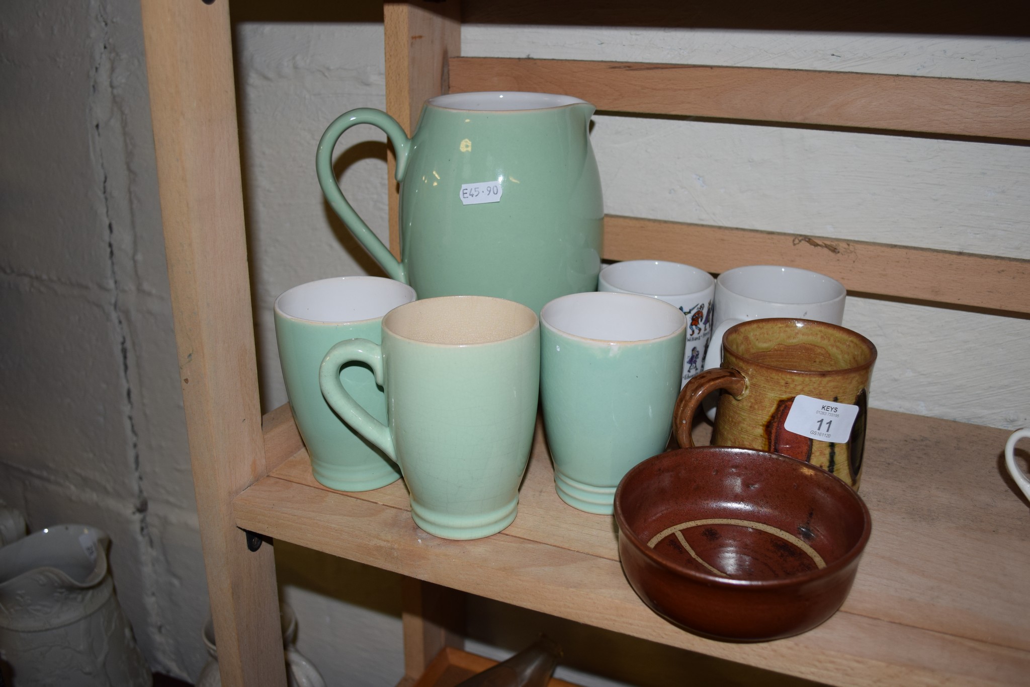 POTTERY ITEMS INCLUDING SET OF JUG AND THREE BEAKERS BY LOVATT