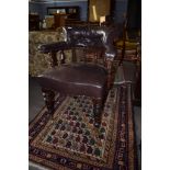 Late 19th century mahogany framed desk tub chair^ upholstered in brown leather button back raised on