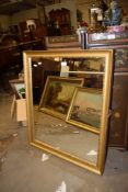 MODERN GILT FRAMED WALL MIRROR, 66CM WIDE