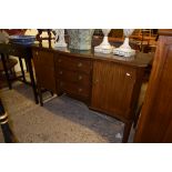 MODERN SERPENTINE SHAPED SIDEBOARD WITH THREE CENTRAL DRAWERS AND LARGER DRAWERS EITHER SIDE,