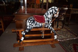 Vintage rocking horse painted in grey dapple on a pine stand^ 96cm high