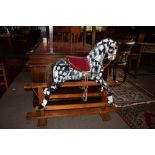 Vintage rocking horse painted in grey dapple on a pine stand^ 96cm high