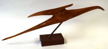 A Denis Cummings, ARBS, DA, Wooden sculpture of a Gambian seabird mounted on a wooden block, 80cm