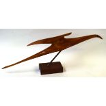 A Denis Cummings, ARBS, DA, Wooden sculpture of a Gambian seabird mounted on a wooden block, 80cm