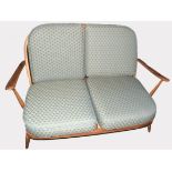 Mid century Ercol two seater sofa, upholstered with green diamond patterned cushions, 133cm wide