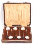 Cased set of six George V bean end coffee spoons within the original fitted case, Birmingham 1931 by