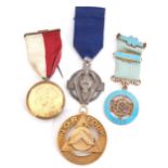 Group of Masonic medals including two silver gilt examples, the first circular shaped with triangle,