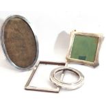 Mixed Lot: silver mounted photograph frames, a George V silver oval shaped example, wooden easel