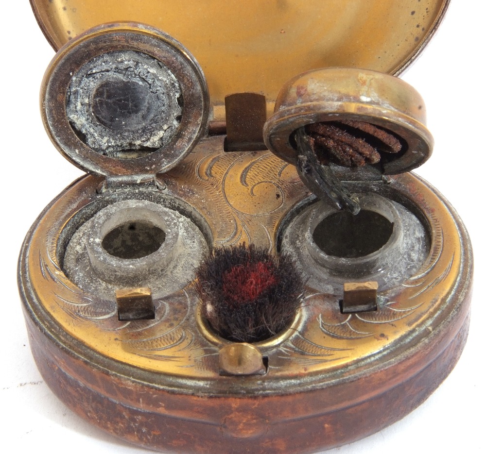 Victorian leather encased and metal framed travelling double inkwell, the hinged lid opening to - Image 2 of 3