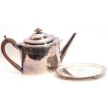George III oval tea pot engraved with medallions, leaves and two vacant cartouches, having angular