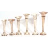 Group of six assorted hallmarked trumpet specimen vases with loaded circular bases, the tallest